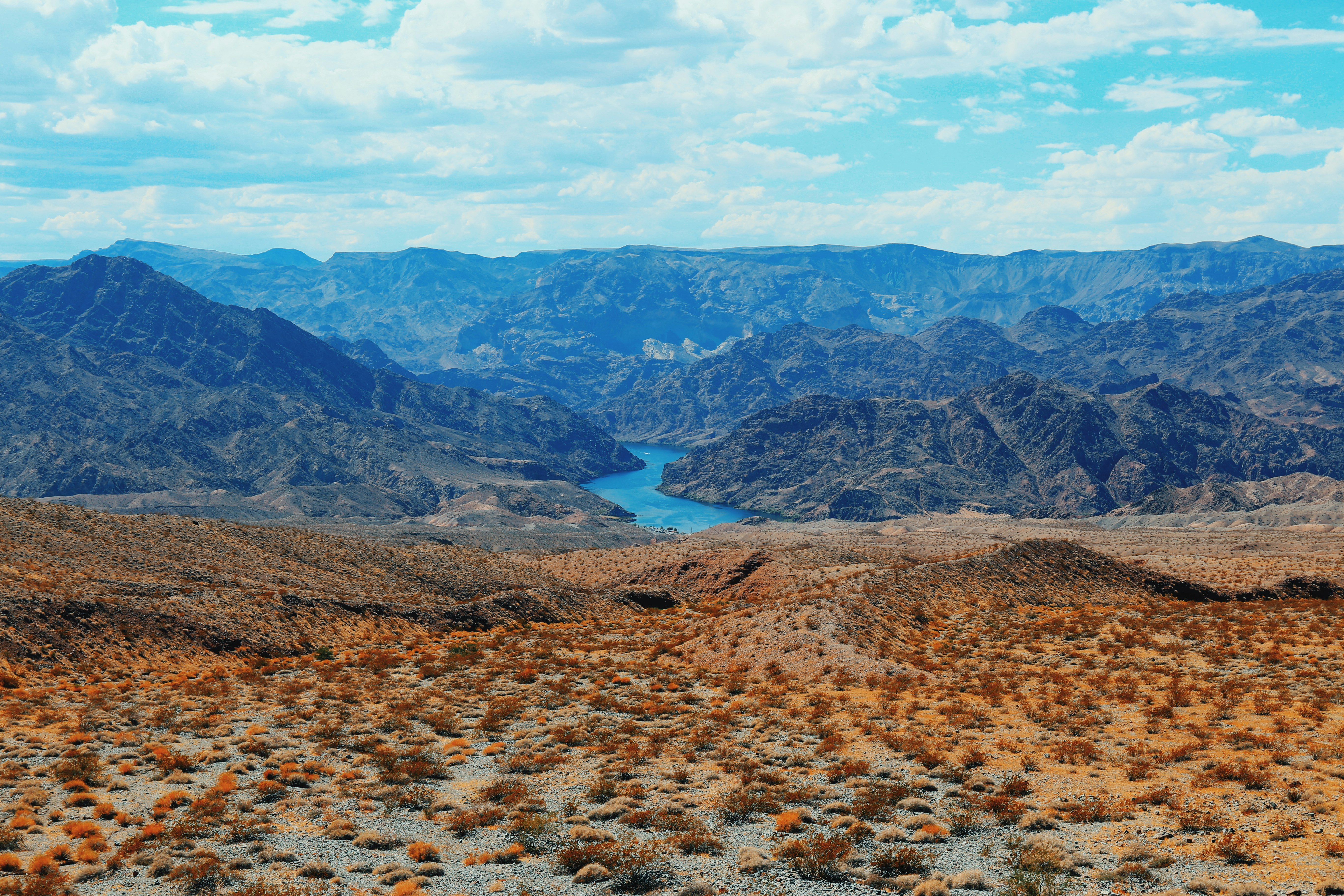 brown and green mountains under blue sky during daytime